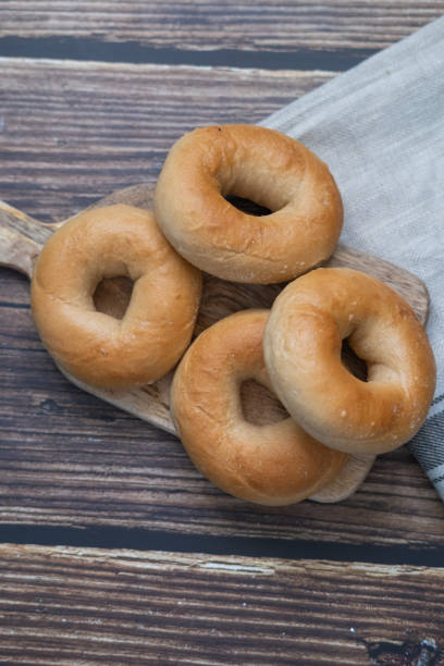 istock Bagels on a wooden table. Top view. Vertical picture. 1199751206