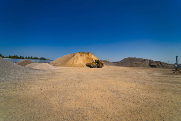 Quarry aggregate with heavy duty machinery. Construction industry. Horizontal