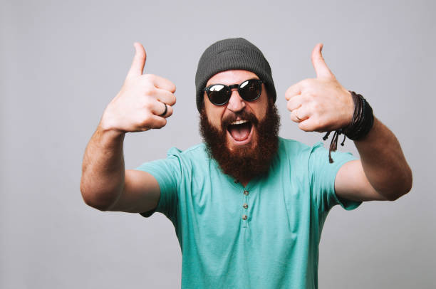 istock Amazed bearded man with sunglasses showing thumbs up 1199752902
