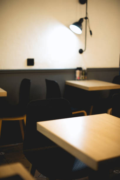 istock Coffee shop interior background, chairs and tables 1199758698