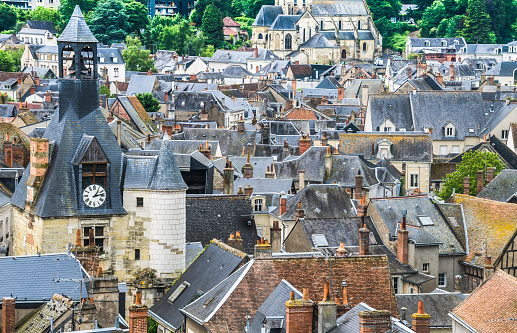 Overview of the chimneys, rooftops and clock tower of the village of Amboise, France