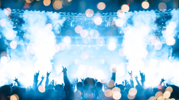 istock Vibrant concert image showing people having fun during a music show 1199760504