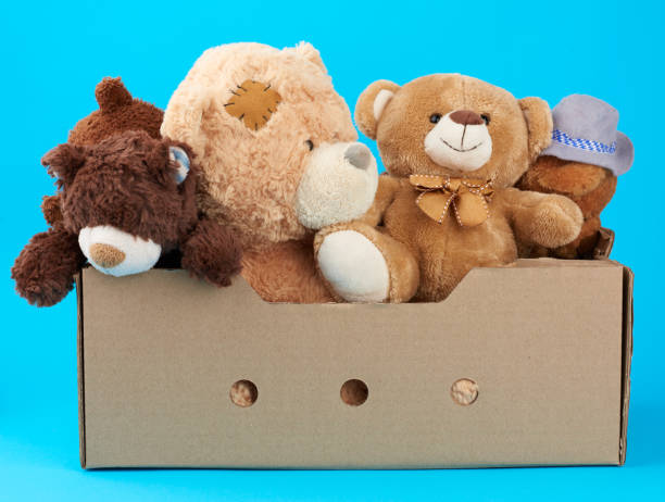 istock brown cardboard box with various teddy bears 1199760612