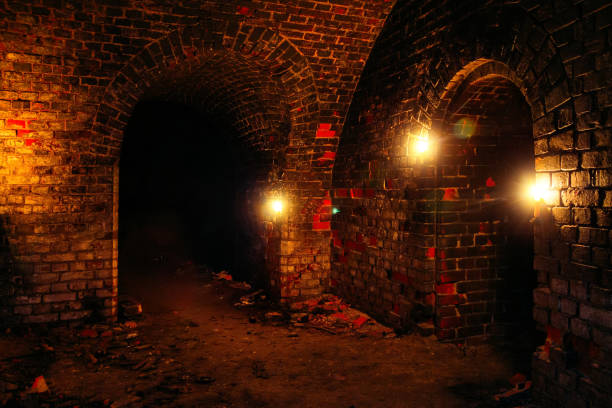 istock Dark dungeon under the old german fortress illuminated by candles 1199765053