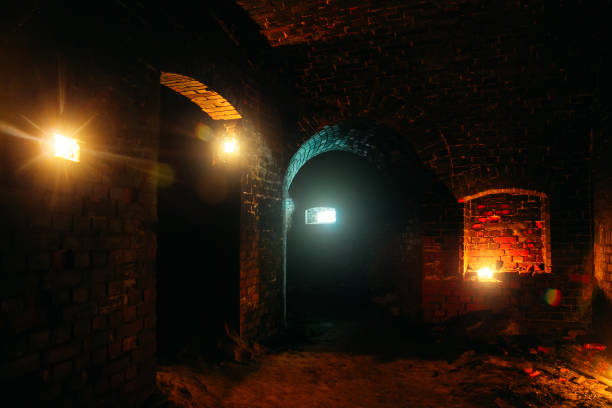 istock Dark dungeon under the old german fortress illuminated by candles 1199766028