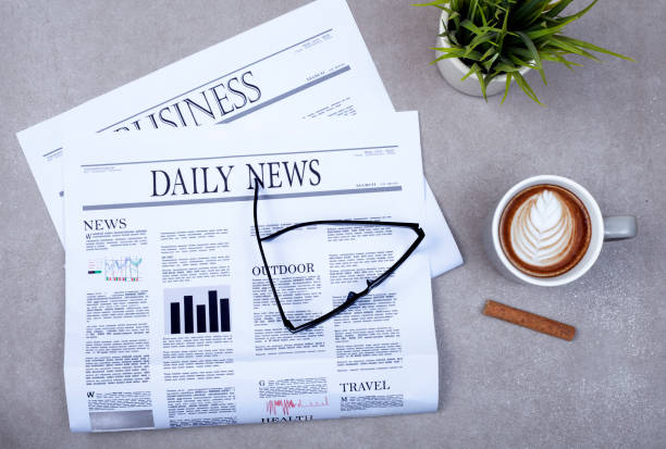 istock newspaper and coffee on office desk 1199772907