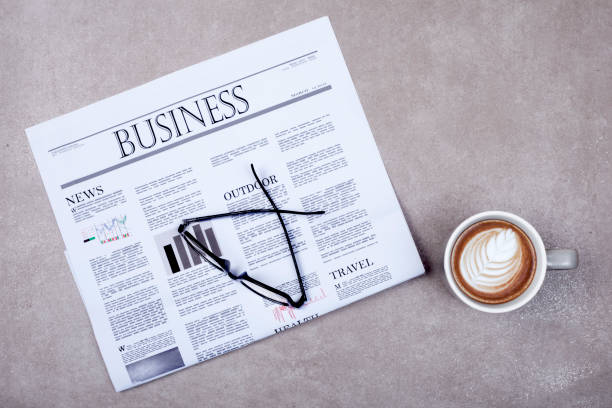istock newspaper and coffee on office desk 1199773436