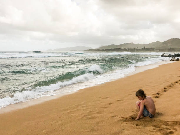 istock Child plays on a. beautiful island beach 1199773797