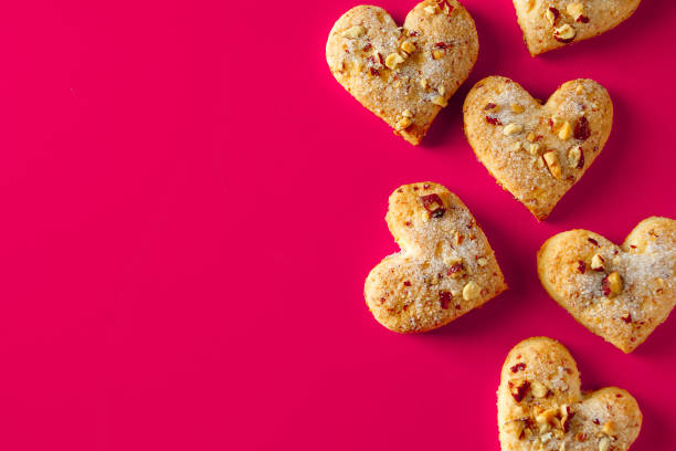 istock Heart shaped cookies for valentines day on pink background. 1199774097