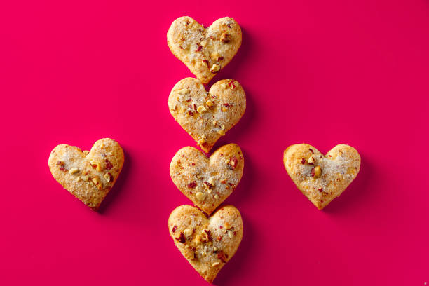 istock Heart shaped cookies for valentines day on pink background. 1199774142