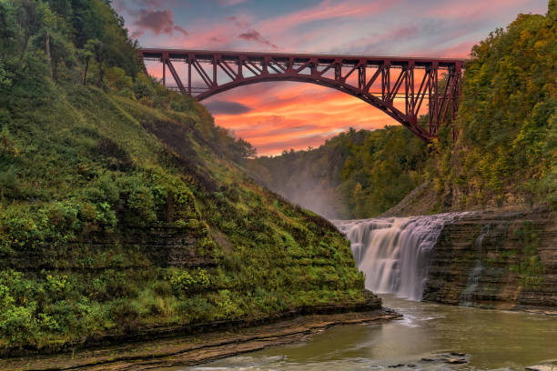 sunset over the upper falls and arch bridge at letchworth state park - new york canyon imagens e fotografias de stock