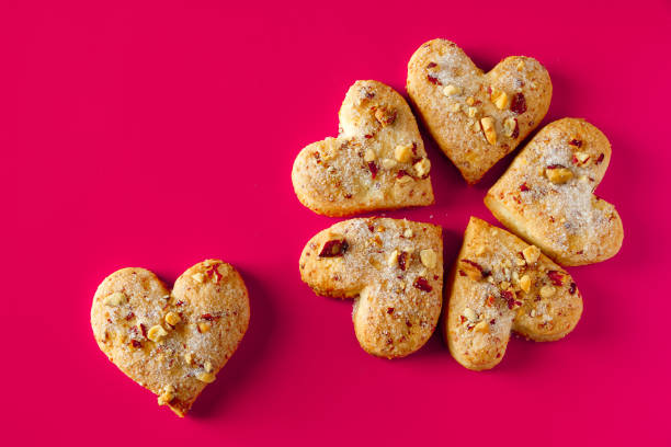istock Heart shaped cookies for valentines day on pink background. 1199775078