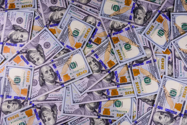 istock Background of one hundred dollar banknotes 1199777393