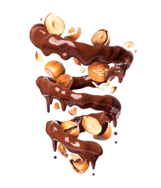 istock Chocolate splashes in spiral shape with crushed hazelnuts, isolated on a white background 1199778637
