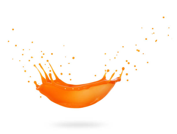 istock Splashes of fresh orange juice isolated on white background 1199778638