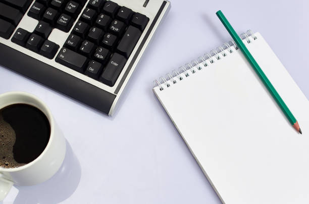 istock White office desk table with blank, computer keyboard and other office supplies. Top view with copy space, flat lay. 1199778712