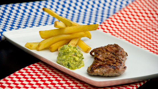 Restaurant Steak  with guacamole and french fries