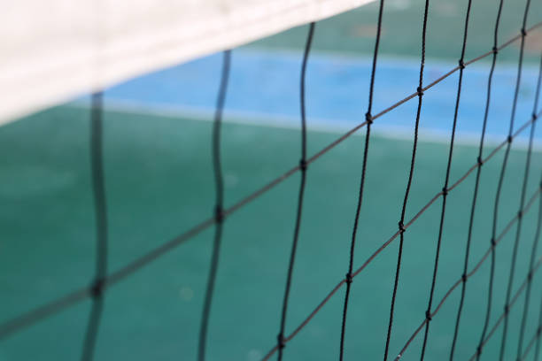 istock Black sport net and white stripe on top with green floor background. 1199792748
