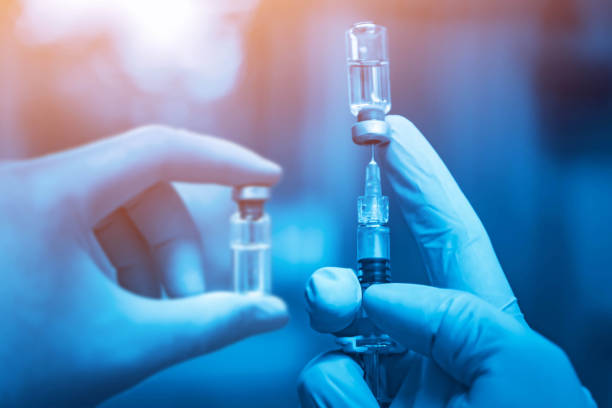 Vaccine vial dose flu shot drug needle syringe,medical concept vaccination hypodermic injection treatment disease care hospital prevention immunization illness disease baby background. stock photo jeringa de aguja de inyección de gripe vial de la vacuna, concepto médico vacunación inyección hipodérmica tratamiento de la enfermedad de cuidado de la enfermedad hospitalaria prevención de la enfermedad de la enfermedad enfermedad de la enfermedad