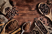 istock Background of coffee beans and grinded coffee on a rustic table 1199797903