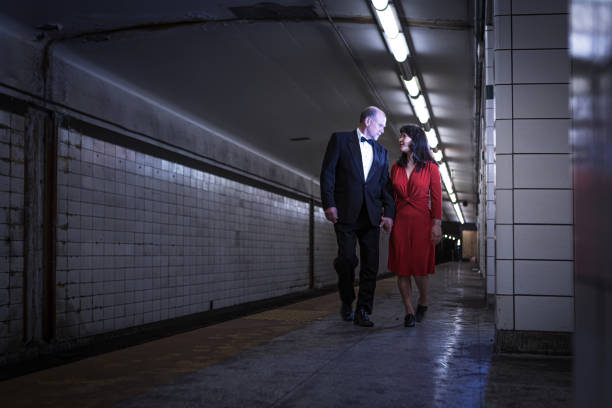 istock Elegant couple walking on subway station 1199800831