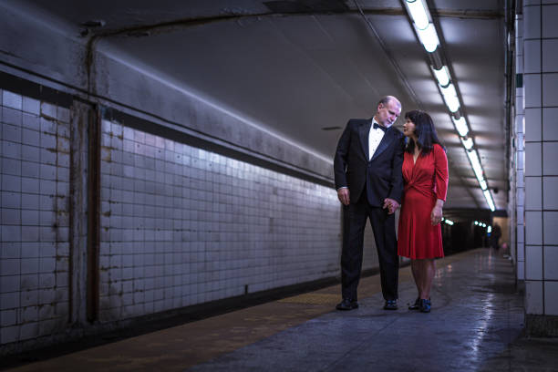 istock Elegant couple waiting for the subway train 1199801391