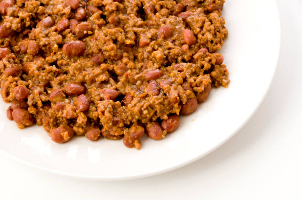 istock Chili con carne on a white plate on white background 1199801519