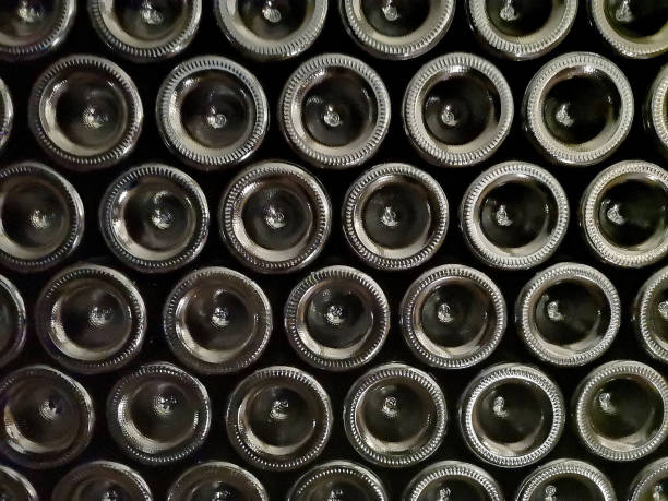 Wine bottles stacked on wooden racks