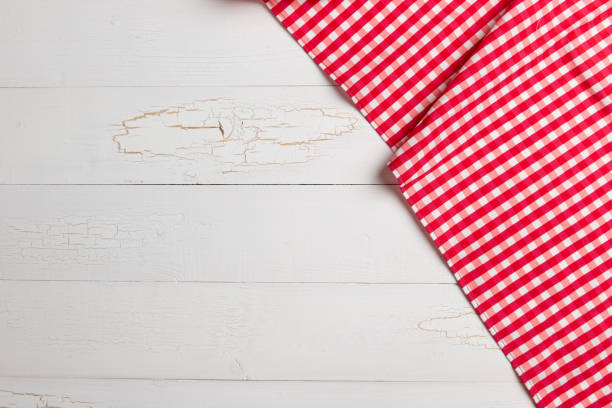 istock Red towel over wooden kitchen table. 1199803328