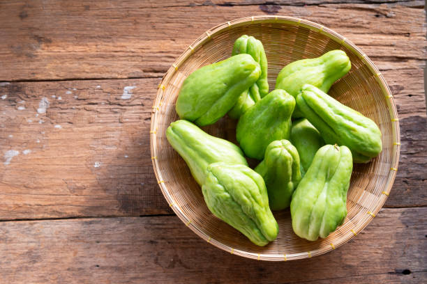 istock Fresh chayote fruits (Sechium edulis) on wood background 1199803621