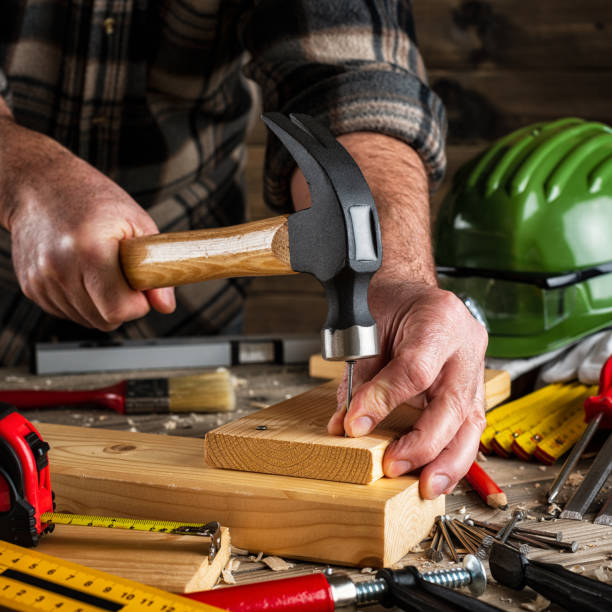istock Carpenter at work on wooden boards. Carpentry. 1199804554