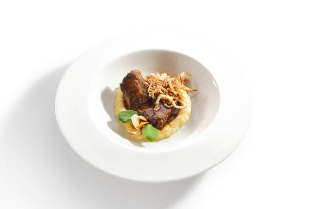 istock Beef Cheeks with Mashed Potatoes, Greens and Onion Fries 1199805536
