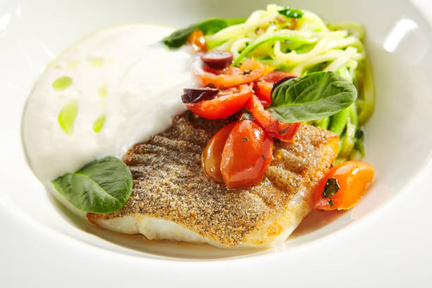 istock Cod Fillet in Cream Sauce with Vegetable Spaghetti Isolated 1199805559