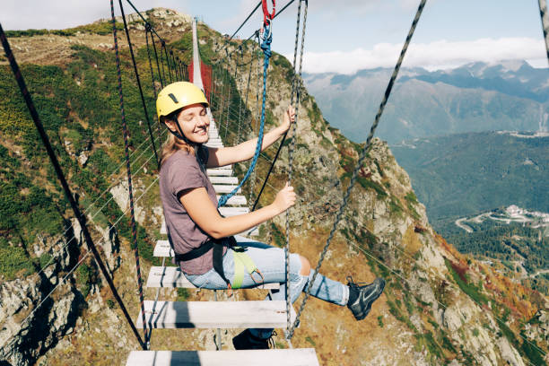 istock suspension bridge high in the mountains 1199807434