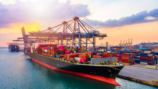 istock Aerial view container ship carrying container in import export business logistic and transportation of international by container ship in the open sea. 1199811342