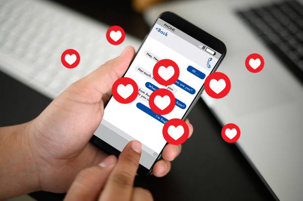 istock man use Social media,social network  phone message from lovers. Send a message love 1199811370