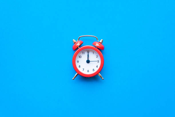istock Abstract creative flat lay vintage blue table top view office background concept red clock on paper color in minimal style, Hot summer holiday time to break workplace at noon for lunch, Retro Hipster back to school vacation 1199811949