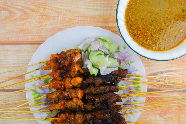 istock The Malaysian delicacy commonly known as Satay (bamboo stick skewered barbequed meat). 1199814652