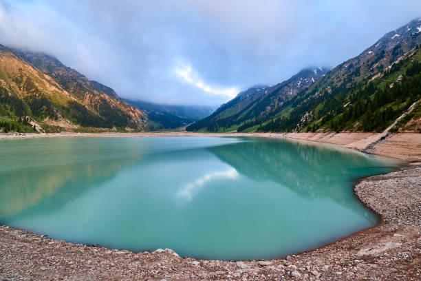 Lake with turquoise water surrounded by a mountains. Ile-Alatau National Park.  Kazakhstan.