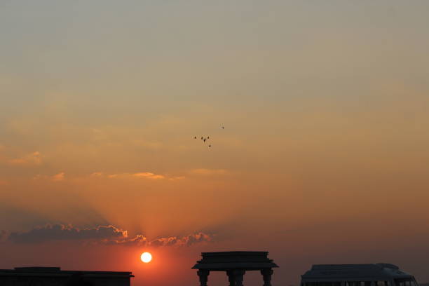 A magnificent view of a sunset near a hindu lord Krishna temple where thousands visit everyday. It is the indian river water  front