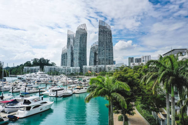 Modern and luxury smart homes in Singapore, seen from above during a hot summer day at the Keppel Bay Yacht Marina area in the city centre.