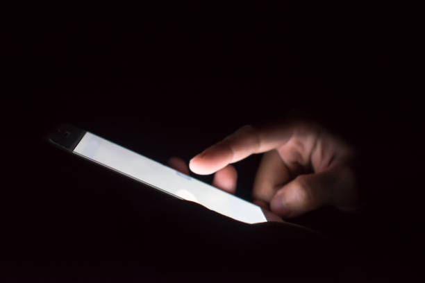 istock People use phone search information at night. 1199826615