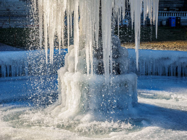 istock Frozen fountain on the lawn 1199830299