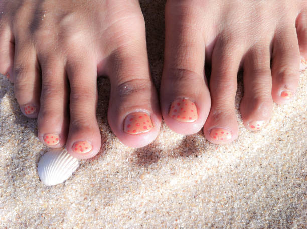 Feet with painted toe nails stock photo