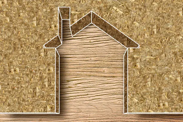 Thermal insulation coatings for residential construction with hemp fiber to reduce thermal losses against a wooden construction structure - Building energy efficiency and environmentally friendly concept image with copy space.