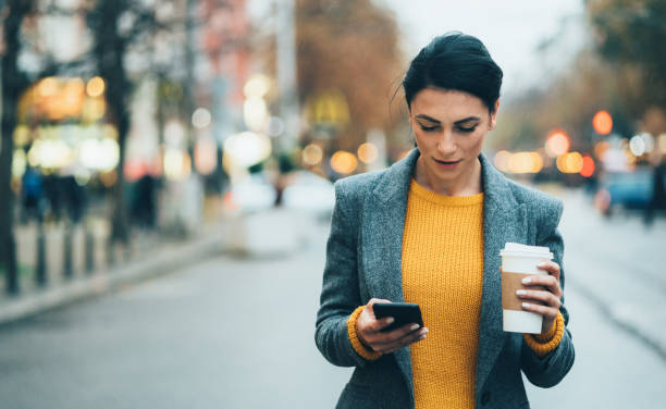 istock Texting in the city 1199839913