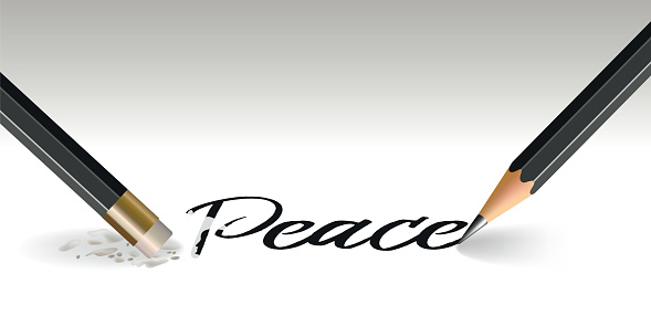 Concept of war and armed conflict with a pencil that writes the word peace and another that erases it with an eraser.
