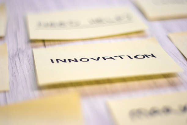 istock Yellow Sticky Note with innovation Message on office desk 1199846274