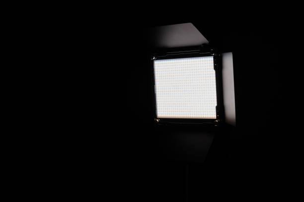 istock Illuminated video light in front of a black background 1199847680