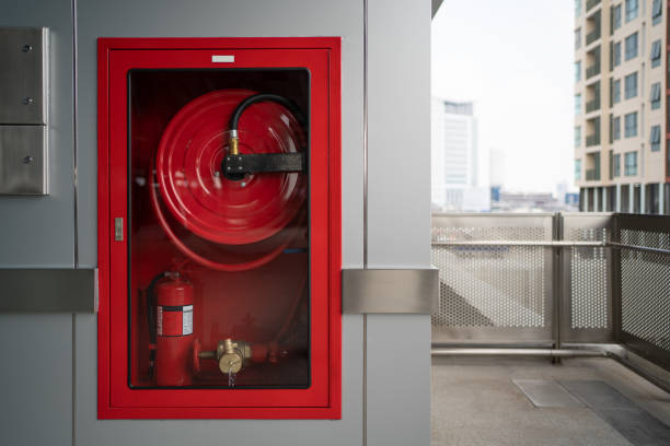 fire hose cabinet at outdoor space - fire hose imagens e fotografias de stock